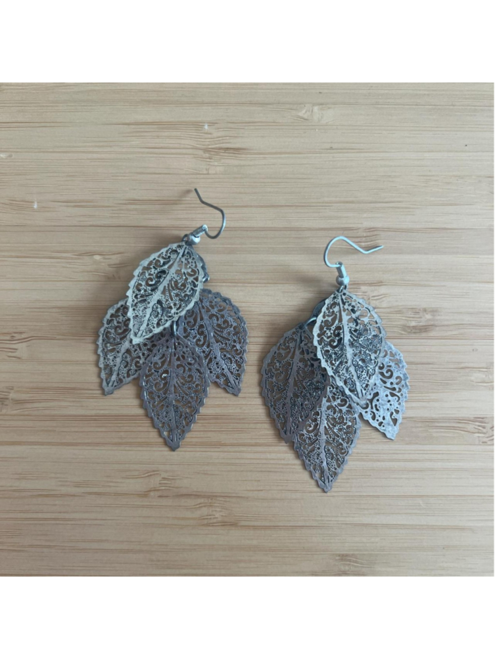 Handmade silver earrings with leaf design
